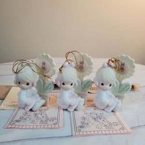 3 Precious Moments ornaments. A Growing love